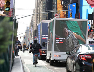 TRUCKS CARRYING VIDEO BILLBOARDS DRIVE THROUGH NEW YORK SHOWING LIVES OF SERBS IN KOSOVO AND METOHIJA